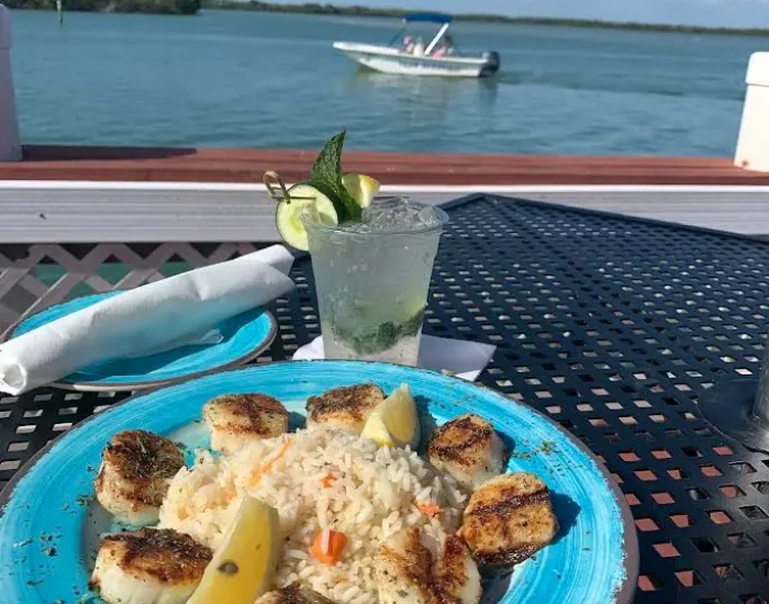 Seared scallops prepared at Paradise Found